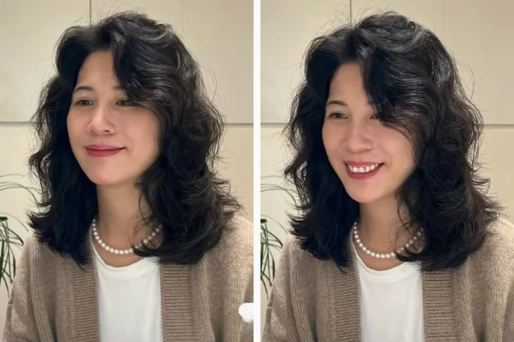 Một quý cô trung niên với mái tóc xoăn bồng bềnh, sang trọng